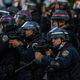 Police officers in Los Angeles wielding weapons during the recent protests against police brutality.